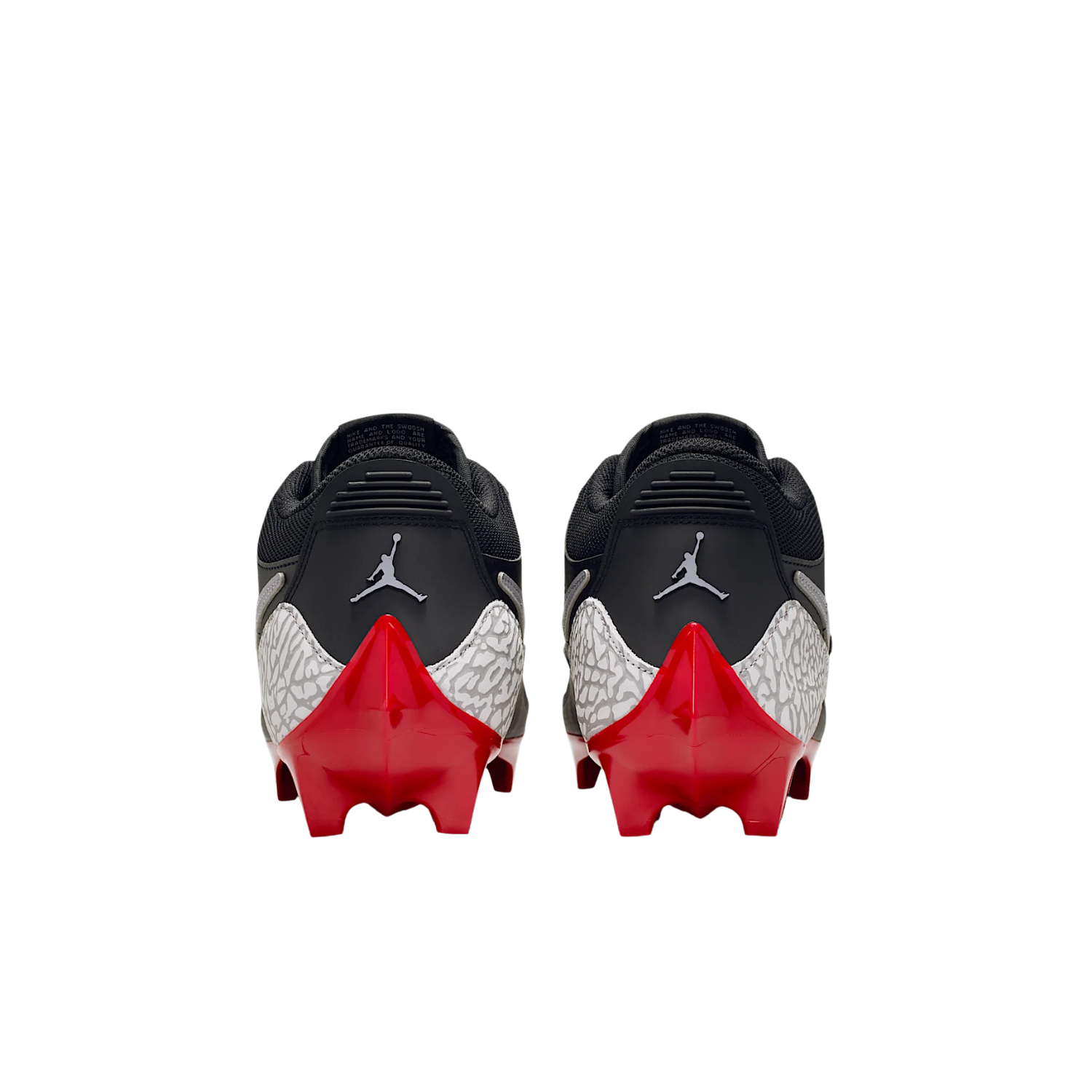 Jordan Legacy 312 Low TD cleats in black and cement grey, rear heel view of the pair with red outsole