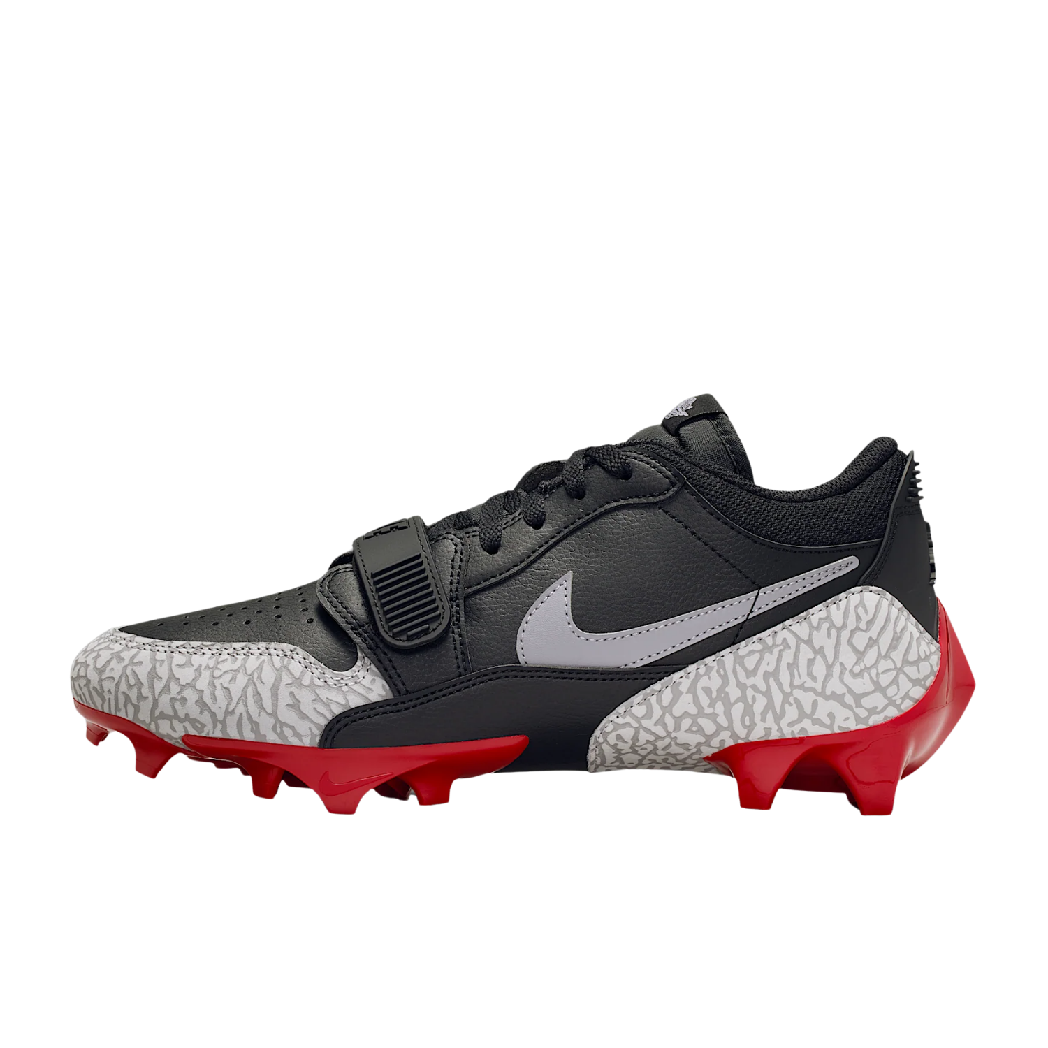 Jordan Legacy 312 Low TD cleat in black and cement grey, medial side view