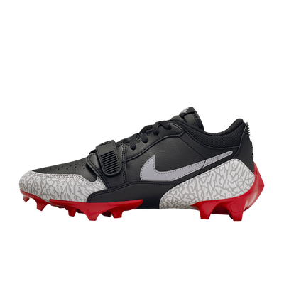 Jordan Legacy 312 Low TD cleat in black and cement grey, medial side view