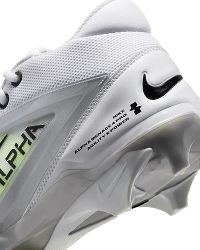 Close-up of Nike Alpha Menace 4 Pro football cleat showcasing white upper, black Nike swoosh, and molded studs for agility and power.